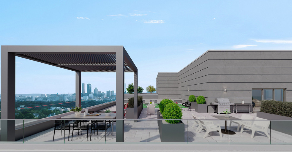 Rooftop terrace with pergola, lounge seating, and skyline views
