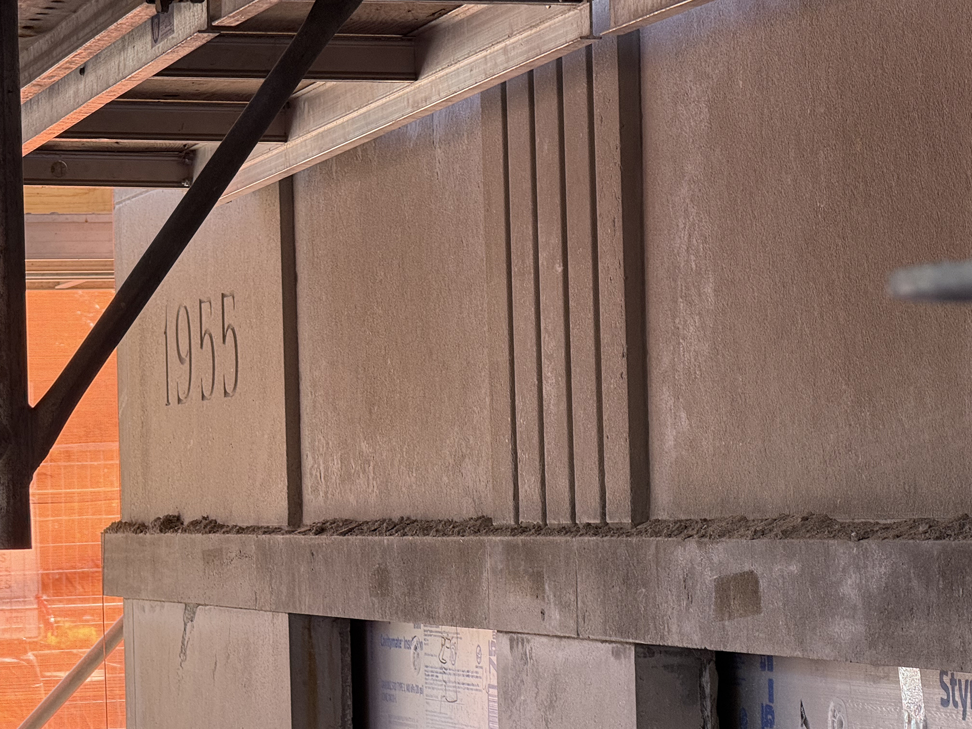 The reinstated 1955 heritage limestone cornerstone during construction of Artefact on Argyle